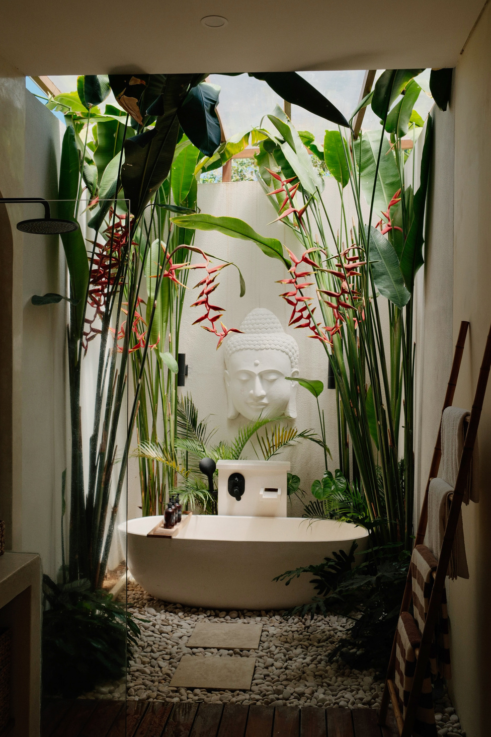 Open-air bathroom surrounded by tropical plants